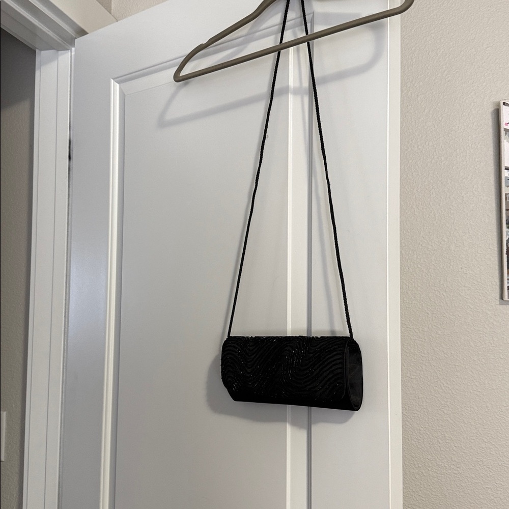 Elegant Black Beaded Evening Clutch
Plus free sheer shoulder wrap. - Picture 2 of 10